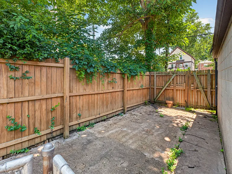 Back Fence Opens, can place Car on back Driveway for long-term storage