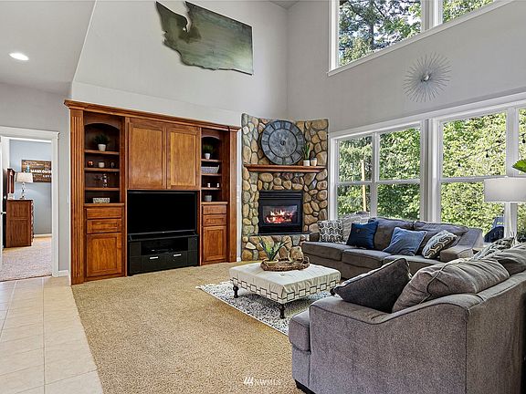 Great Room featuring beautiful rock-faced fireplace is perfect for a cozy night in.