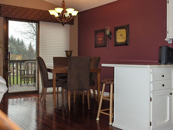 Dining Room -tastefully decorated to compliment beautiful hardwood floors.