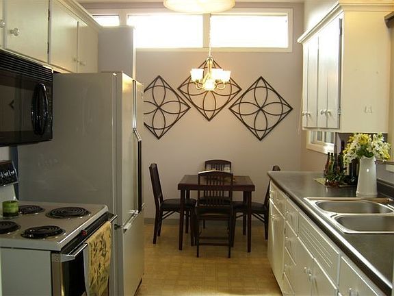 Updated galley kitchen with informal dining 