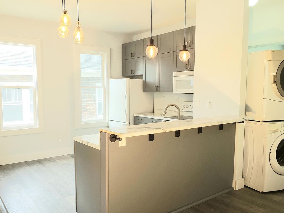 Brand new kitchen with breakfast bar and dishwasher
