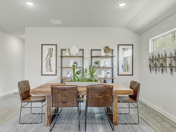 Dining room in the Oscar home plan by Trophy Signature Homes - REPRESENTATIVE PHOTO