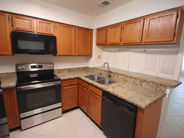 Granite countertops and three new appliances.