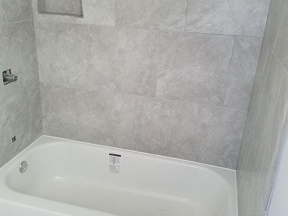 Check out the beautiful tile in the bathrooms with niche.