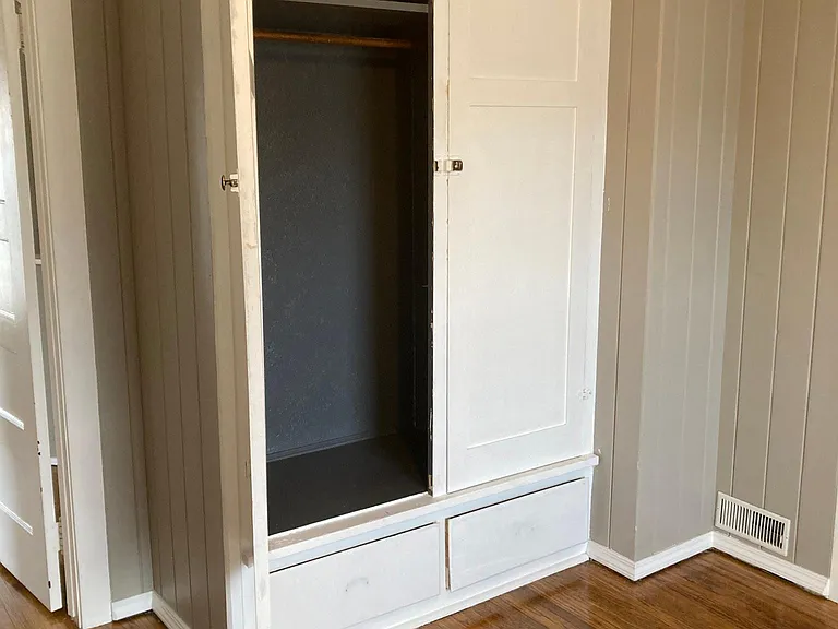 Built-in vintage closet in bedroom