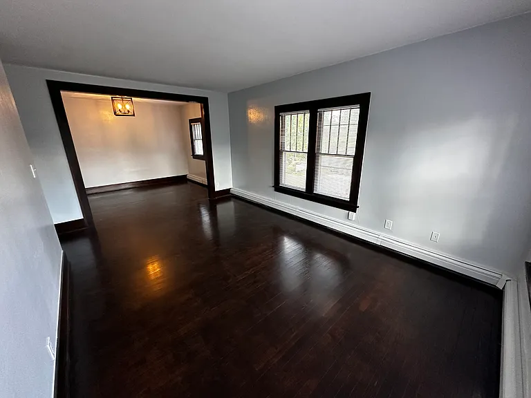 Living room looking into dining room - stunning hardwood floors. Great natural light throughout