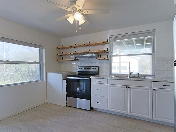 Enjoy cooking (or heating up!) meals in your sunny kitchen