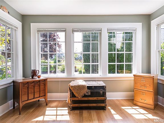 View of the living room and front door. Bedroom in the background