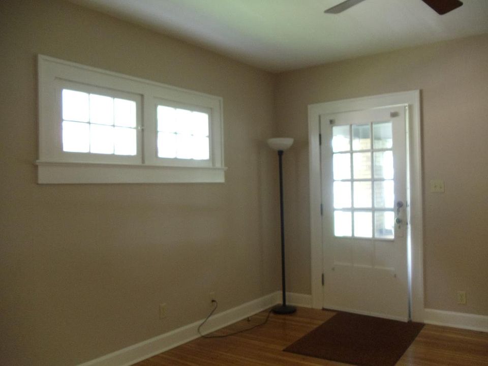 Living area in the front of home. Lots of clean windows and