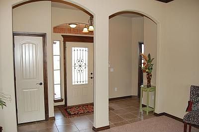 View of the entry w/ double arches for a unique open feeling!