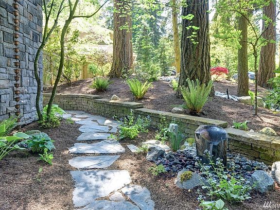 Slate pathway front and side of the house. Copper Rain Chains.
