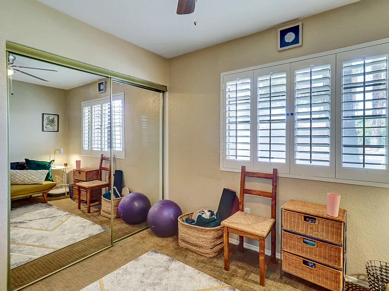 Bedroom 2 Mirrored Closet Doors and plantation shutters