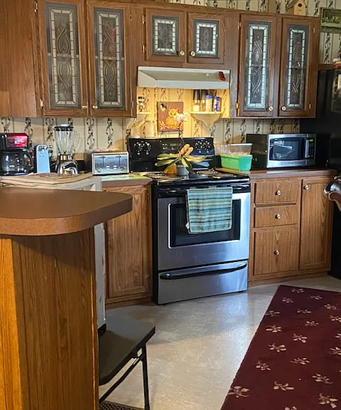 Kitchen configuration-cabinets in the process of being painted with new doors