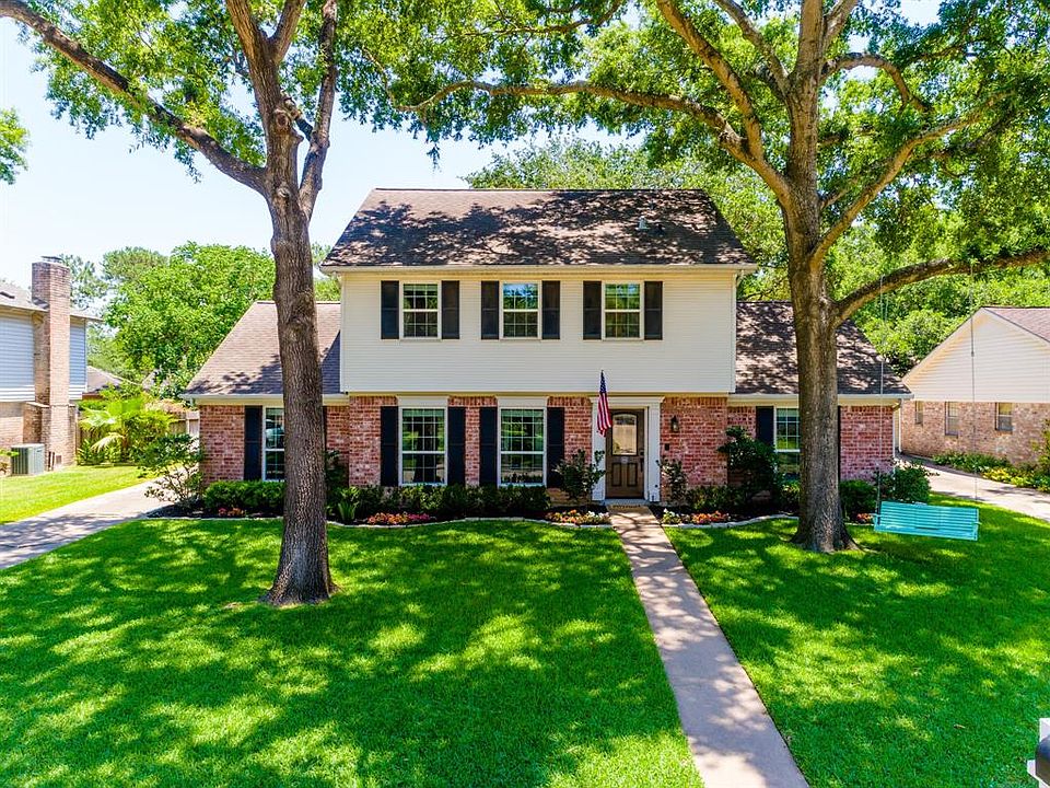 Admire the beautiful trees adorning this charming 2 story Traditional