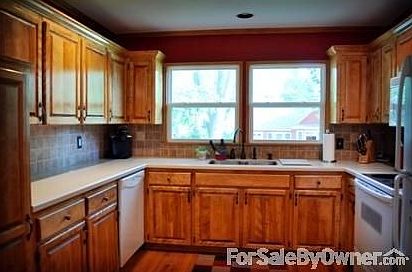 Kitchen : Kitchen gutted & remodeled in 2004 with corian counters & birch cabniets.