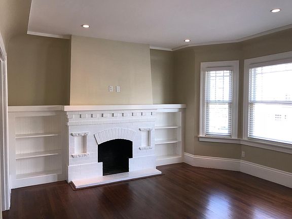 Spacious Living Room with recessed lighting, double pane win