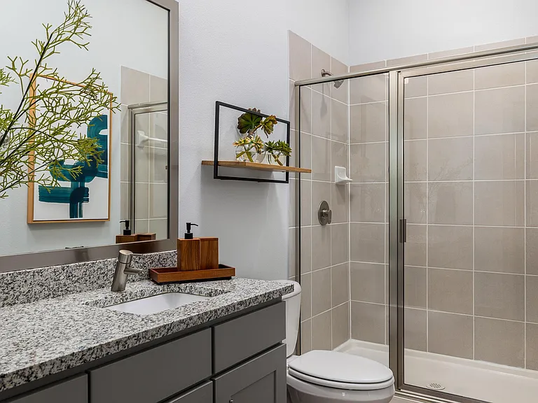 Rhythm Bathroom with Large Shower and Quartz Countertop Vanity