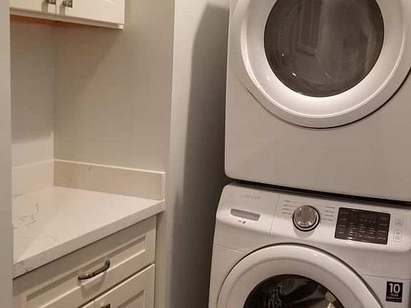In-unit front-loading washer and dryer with alcove for addit