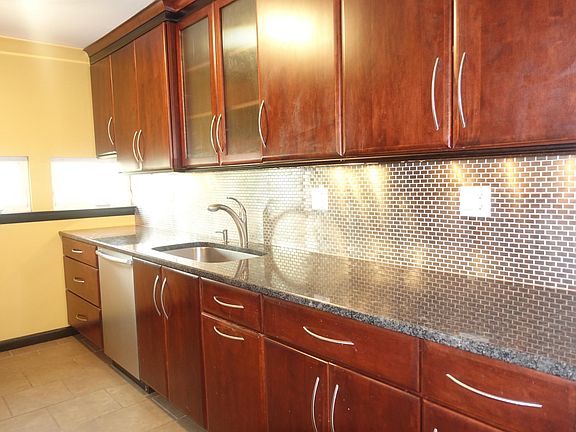 Beautiful Granite Counter tops and ceramic back splash.