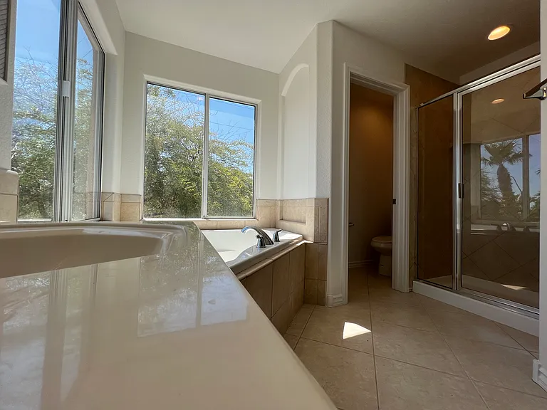 Corner tub with lots of natural light. Blinds will be installed.