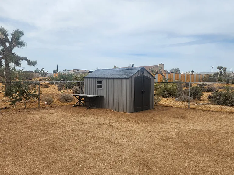 Back yard storage shed and work table