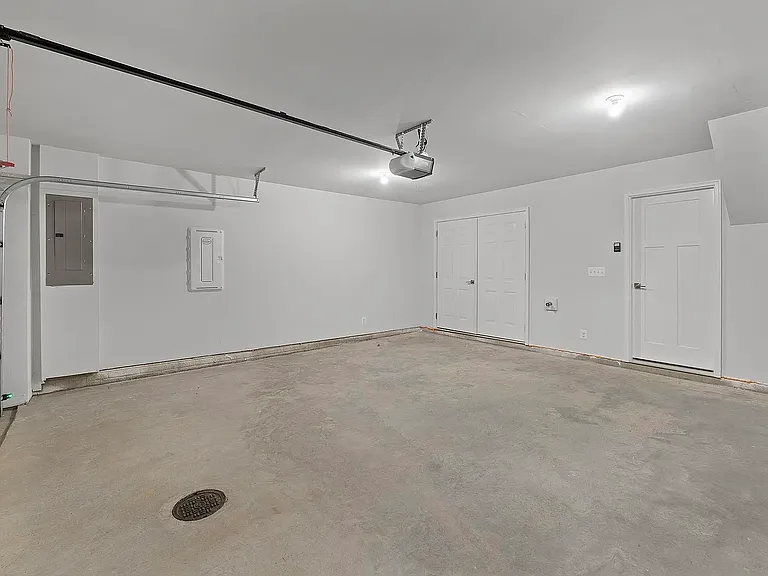 2 car garage with Electric-car charger and generous STORAGE