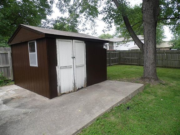Additional storage shed in backyard