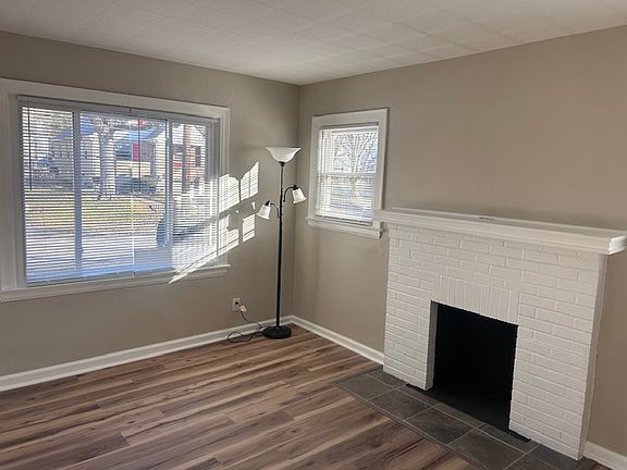 Living room with decorative fireplace