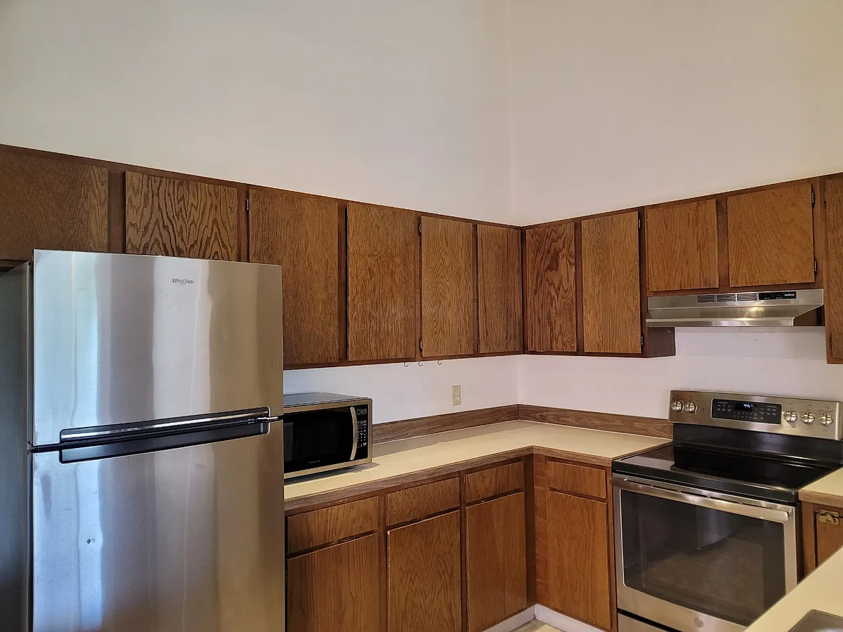 Countertop microwave and lots of cabinets in the kitchen - 2822 Hager Ln #2F