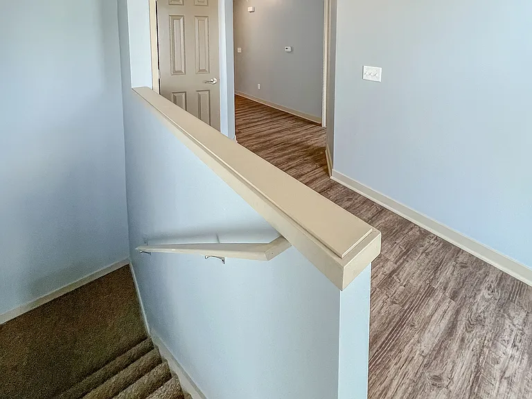 Open stairway from entrance to main area.
