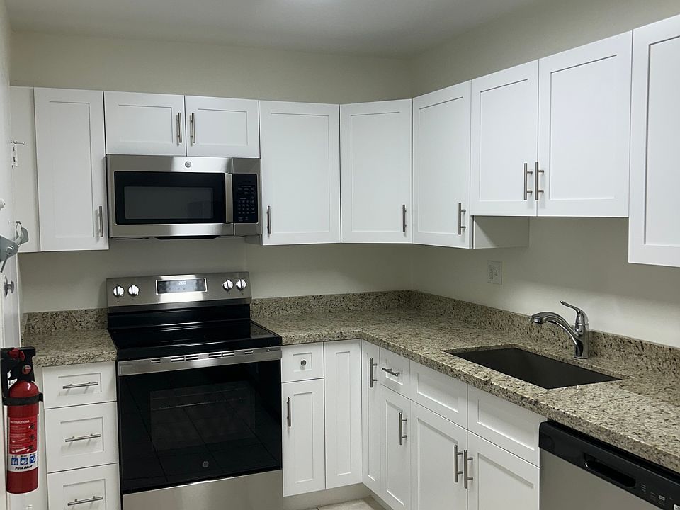 Renovated kitchen, new stainless steel appliances.