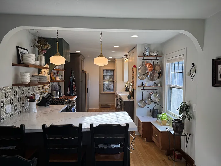 Large peninsula seating for 3 and vintage lighting