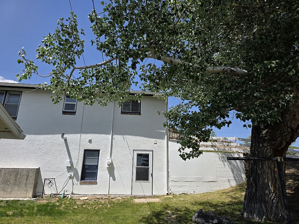 Private entrance through shared outdoor space with mature tree and plenty of shade