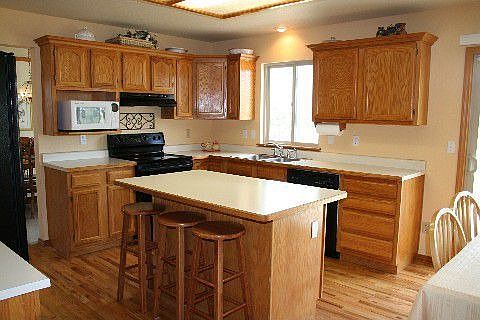 Kitchen with plenty of cupboards and large dining nook