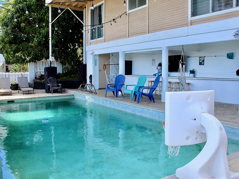 Third level pool, TV and Cabana area with various fruit trees and landscape. Views of oceans/mountains.