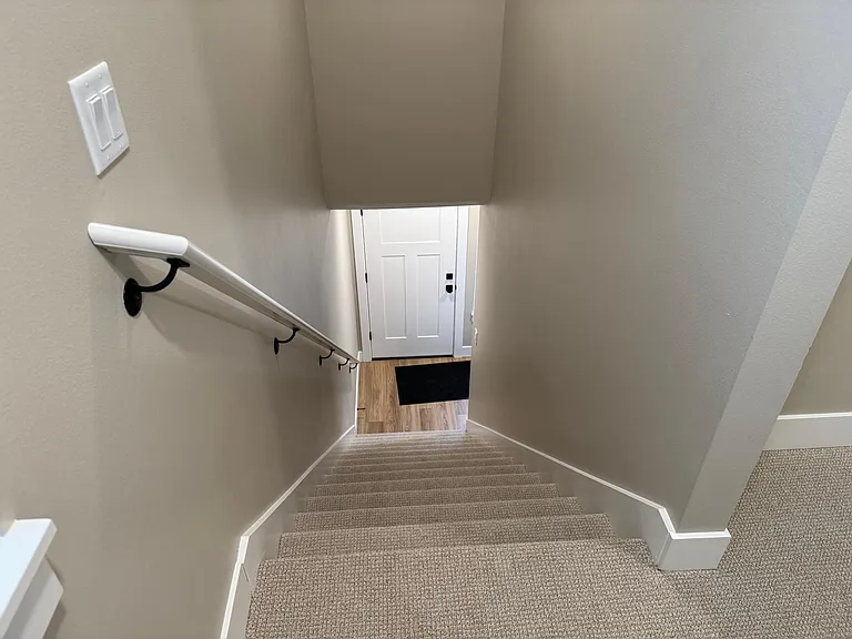 Looking at the entry door from the top of the stairs.