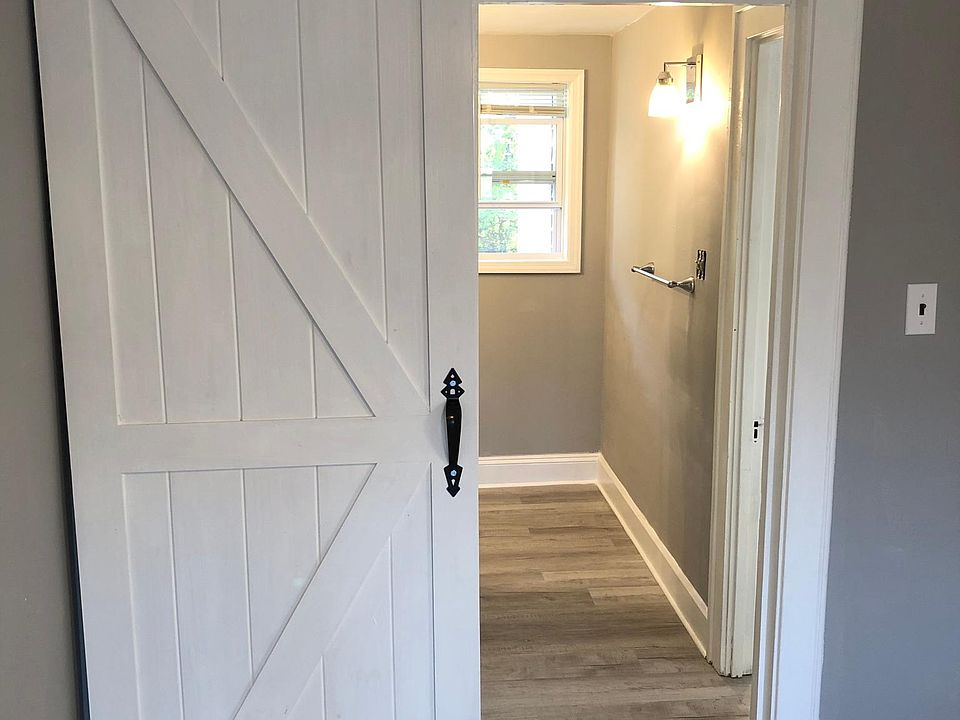 Barn door leading into bathroom