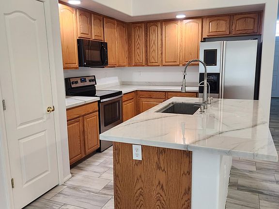 Brand new quartzite countertops, new dishwasher. Refrigerator included