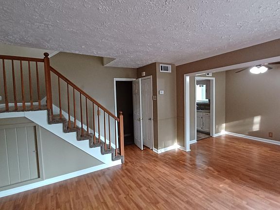 View from living room to dinning area and stair case