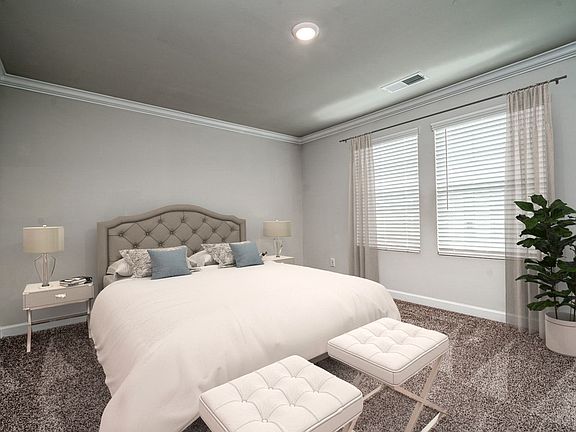 Relax and unwind in the secluded primary suite after a long day.