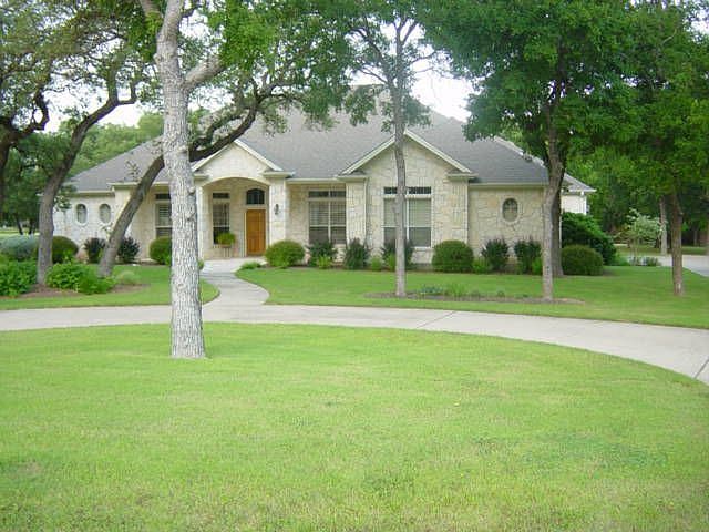 Front of house w/circular drive