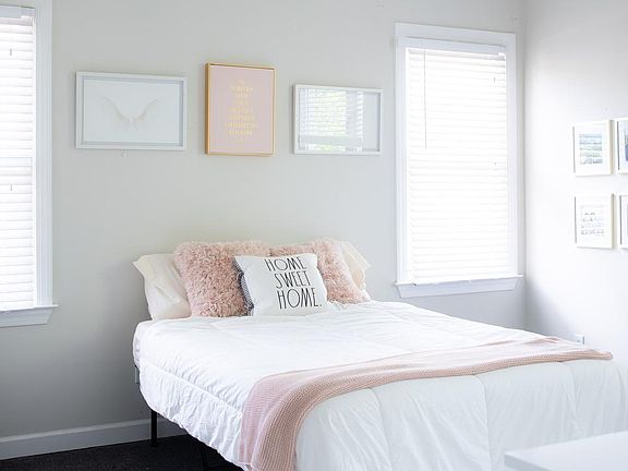 Big windows in every bedroom and 14 foot ceilings, roomy and wonderful! This bedroom looks like you are waking up in a tree house. Beautiful views of trees from your bed in the morning