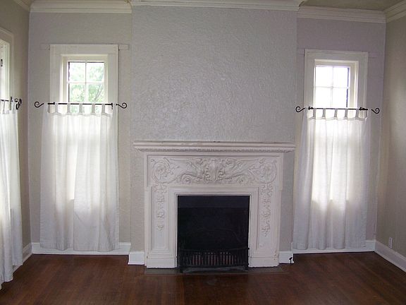 Living Room with Decorative Fireplace & Hardwood Floors