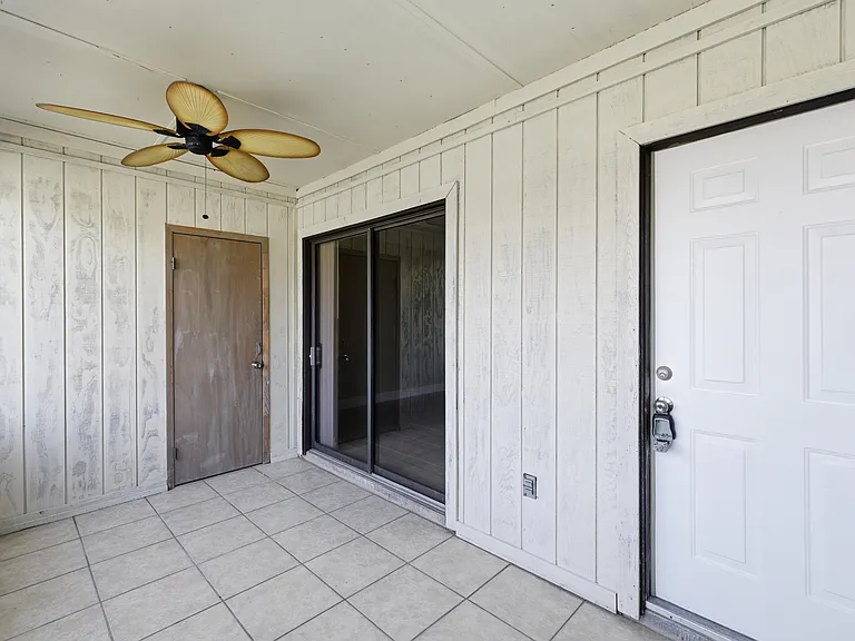 View of the downstairs porch and backdoor