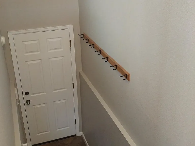 Stairs down to attached garage off of the livingroom.