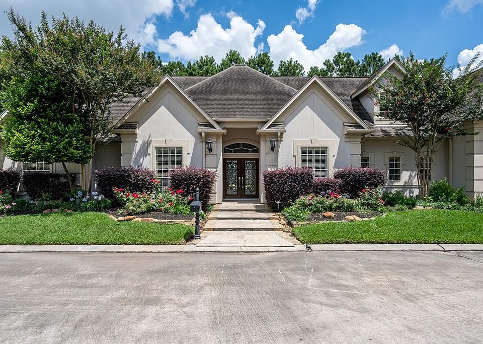 Charming 1.5 story home located in a gated community near Champions Golf Club.