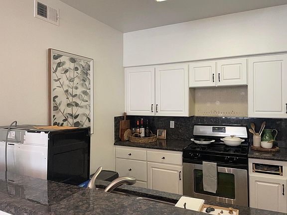 Microwave is now mounted above the range/stove.