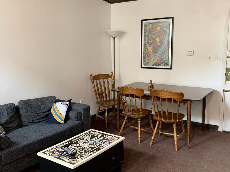 Large living/dining room with high ceilings