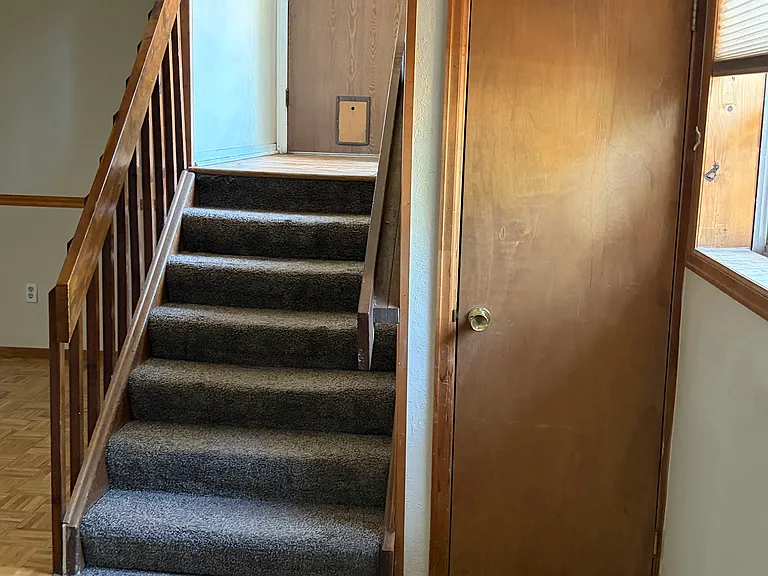 View from Downstairs to Entry and Garage and Storage Closet below stairs