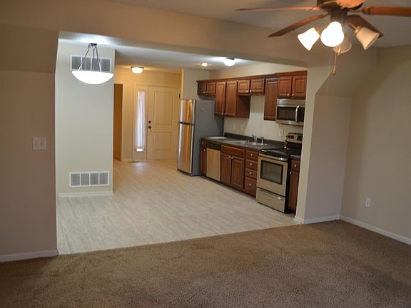 view from living room/front door at the far back of photo